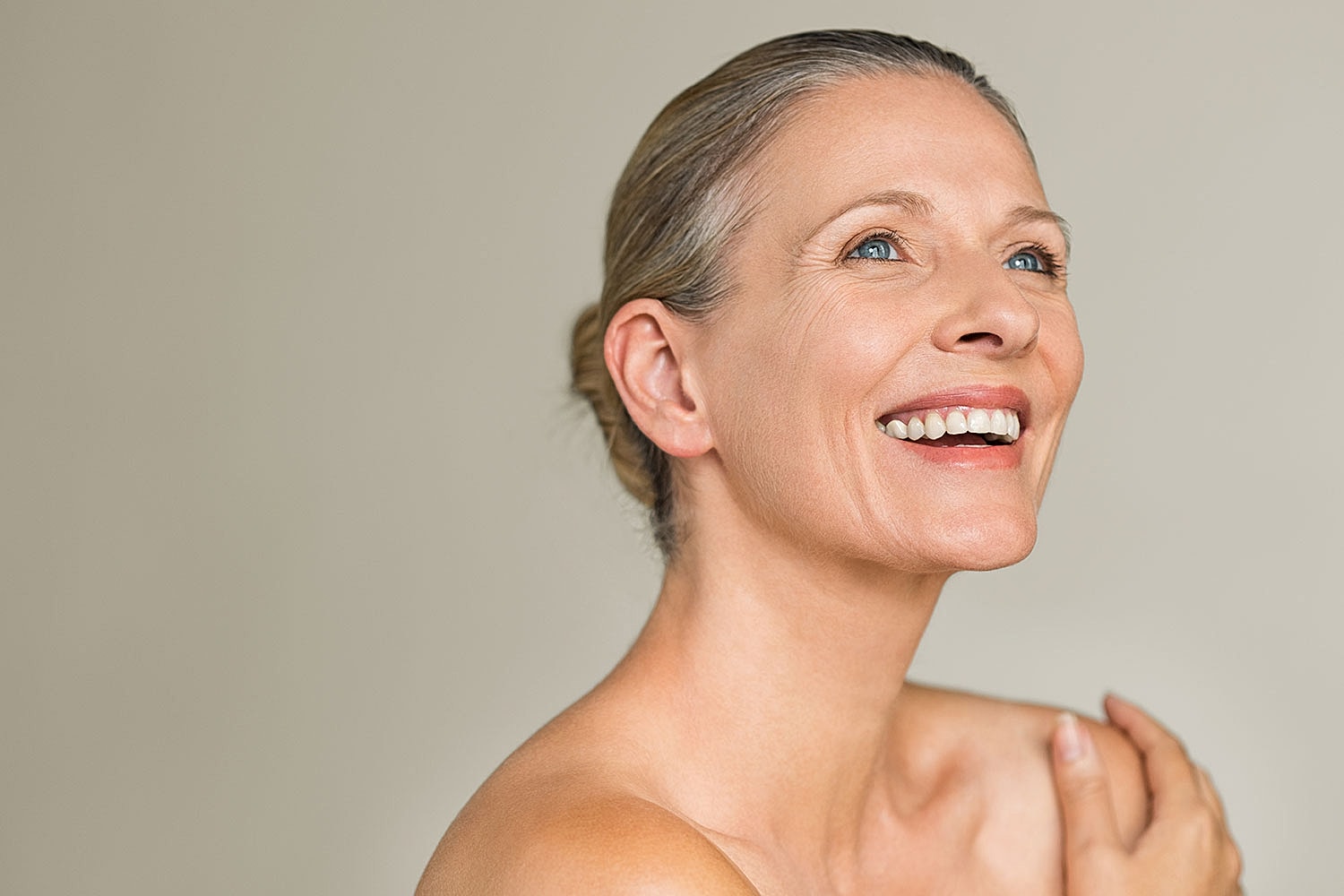 Smiling woman with beautiful skin and hair.
