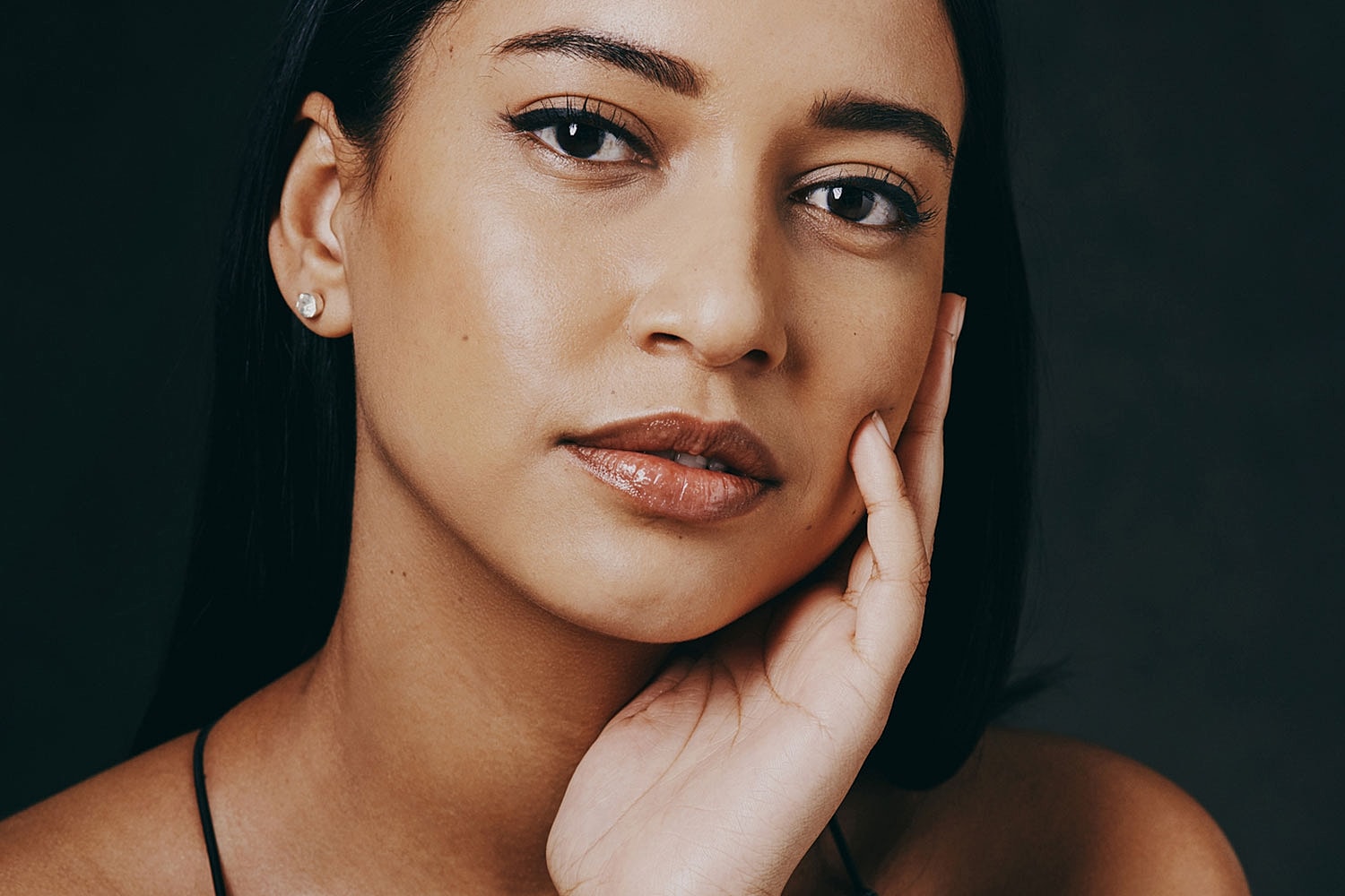 Portrait of a woman with a contemplative expression.