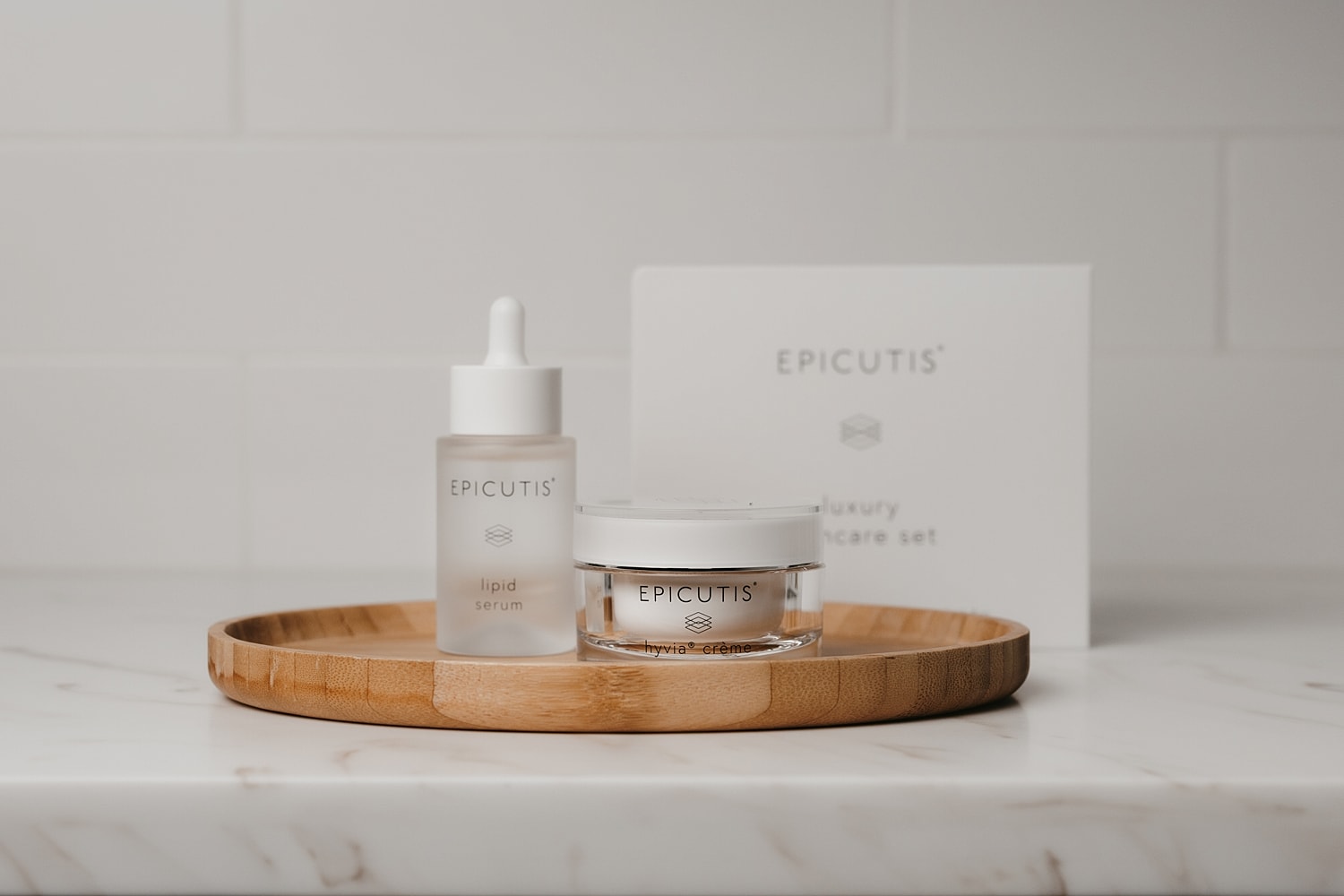 Luxury skincare set with serum and cream.