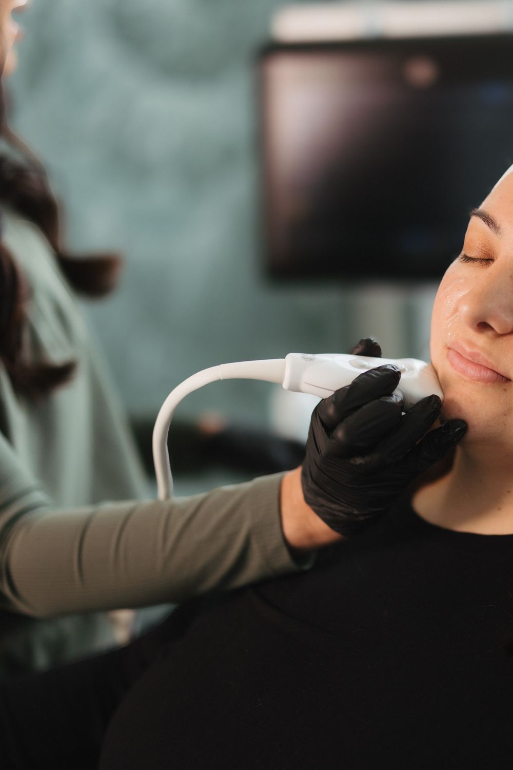 Close-up of smiling woman with natural skin.
