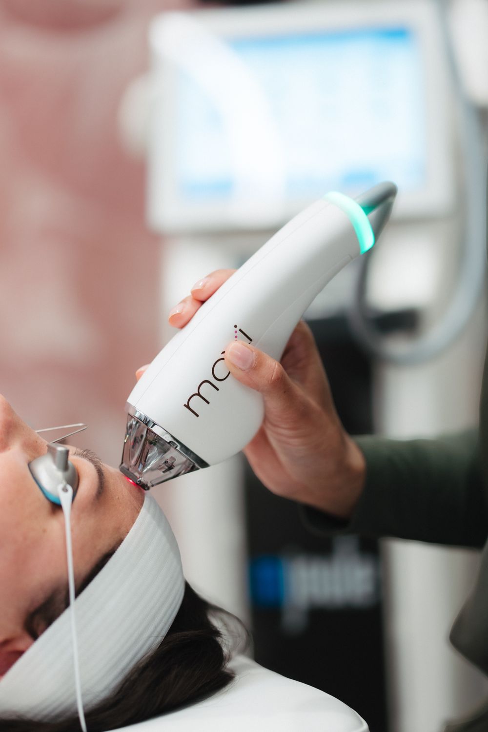 Woman with curly hair and warm sunlight.