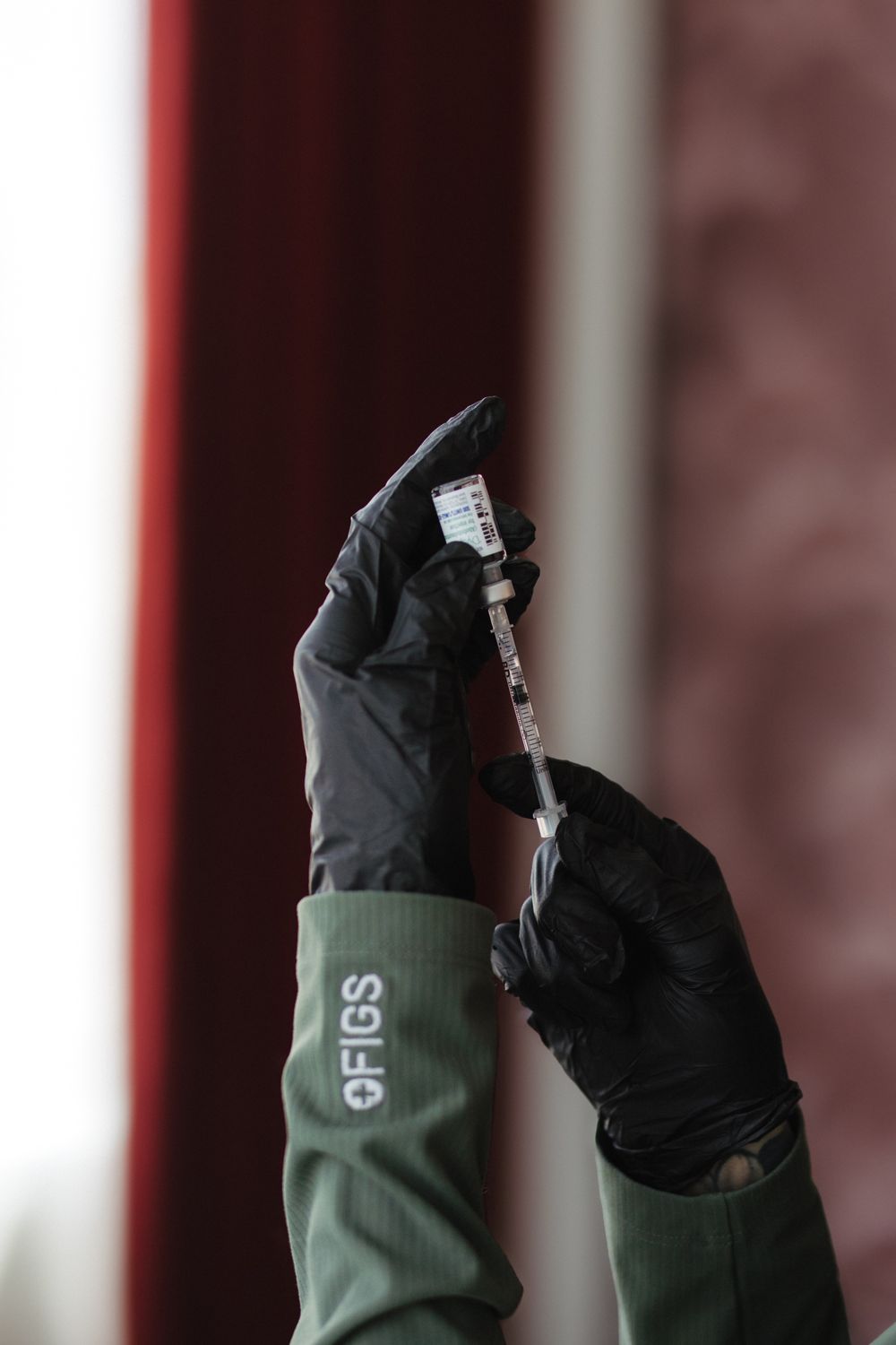 Smiling woman with long, dark hair and natural makeup.