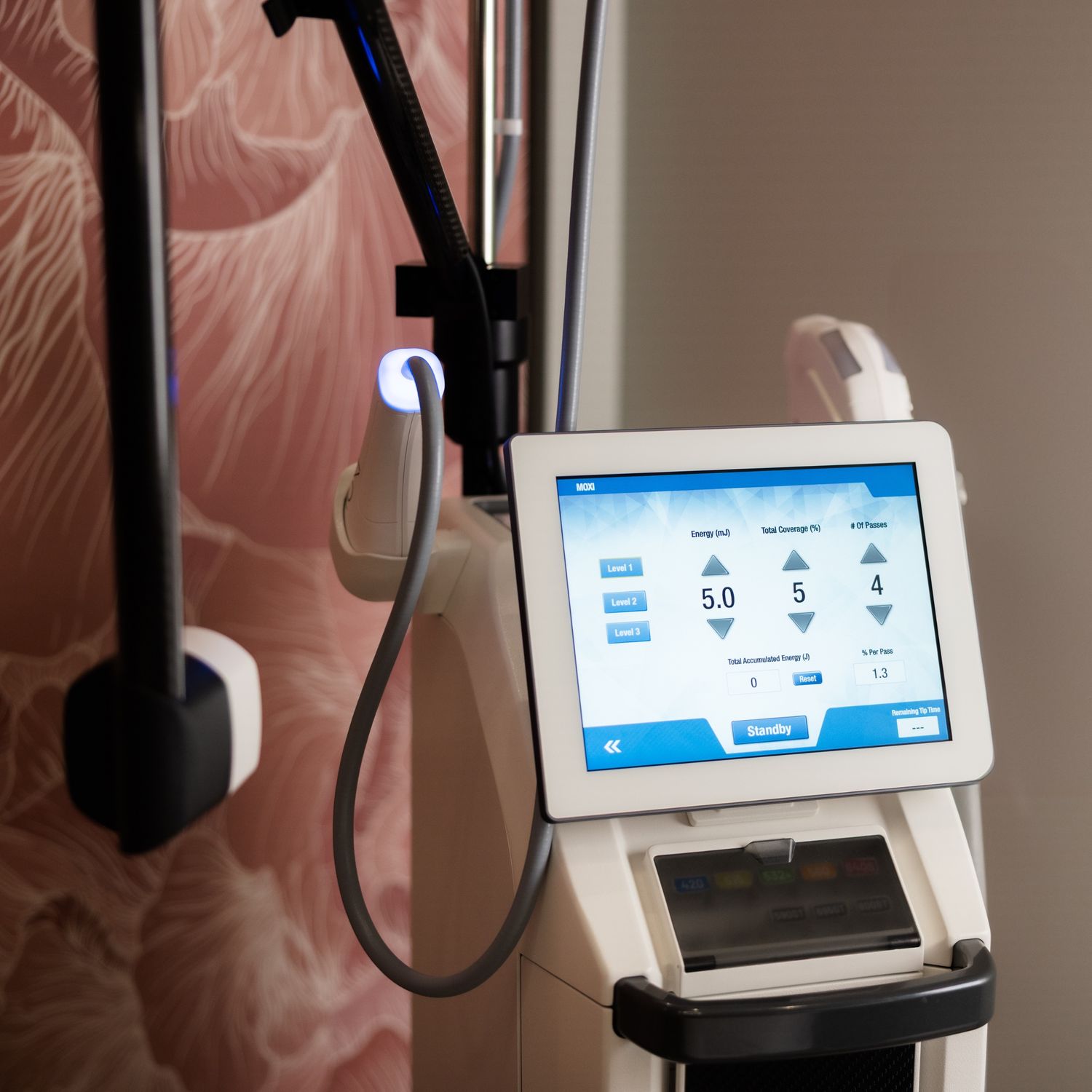 Smiling man with beard against dark background.
