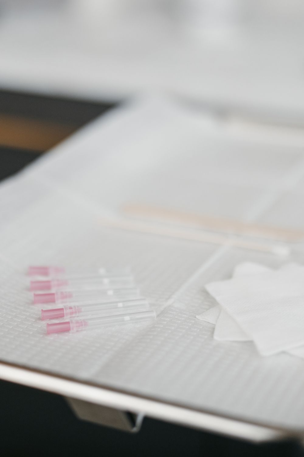 Smiling woman with long blonde hair indoors.
