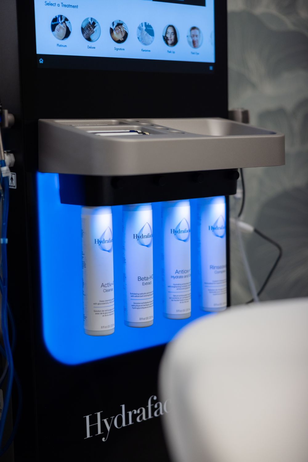 Hands washing wet hair with shampoo.