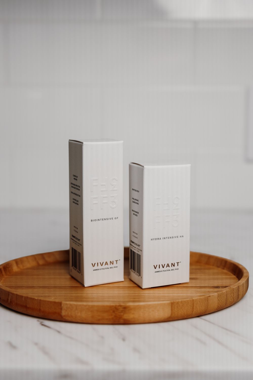 Clear gel droplet on white surface.