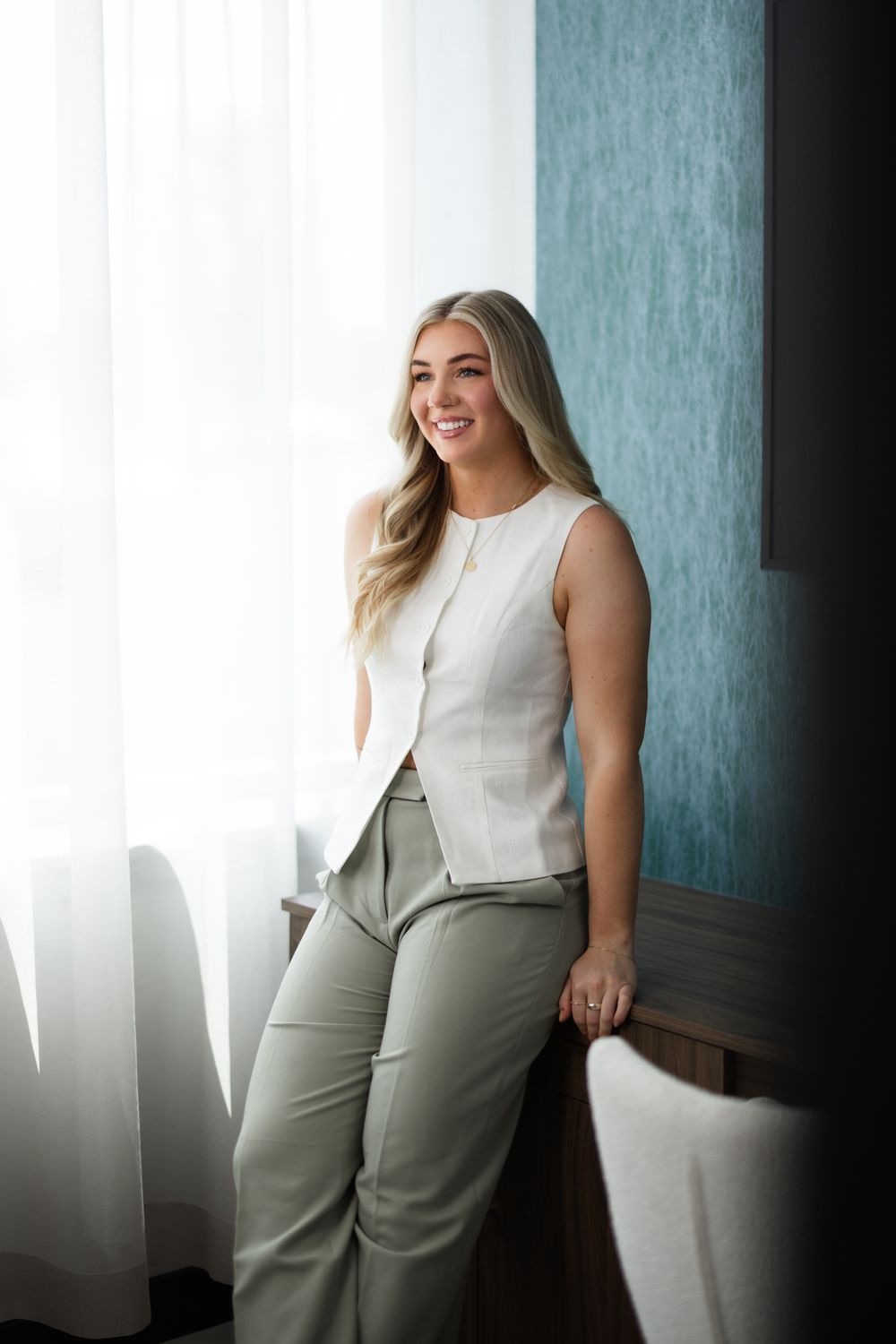 Smiling man touching his face, natural light.