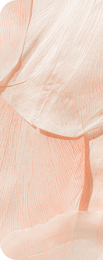 Soft coral draped fabric with textured lines.