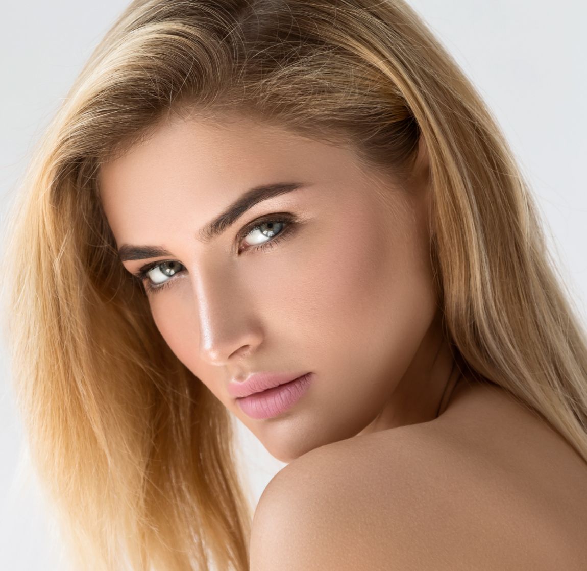 Close-up of a woman with striking features.