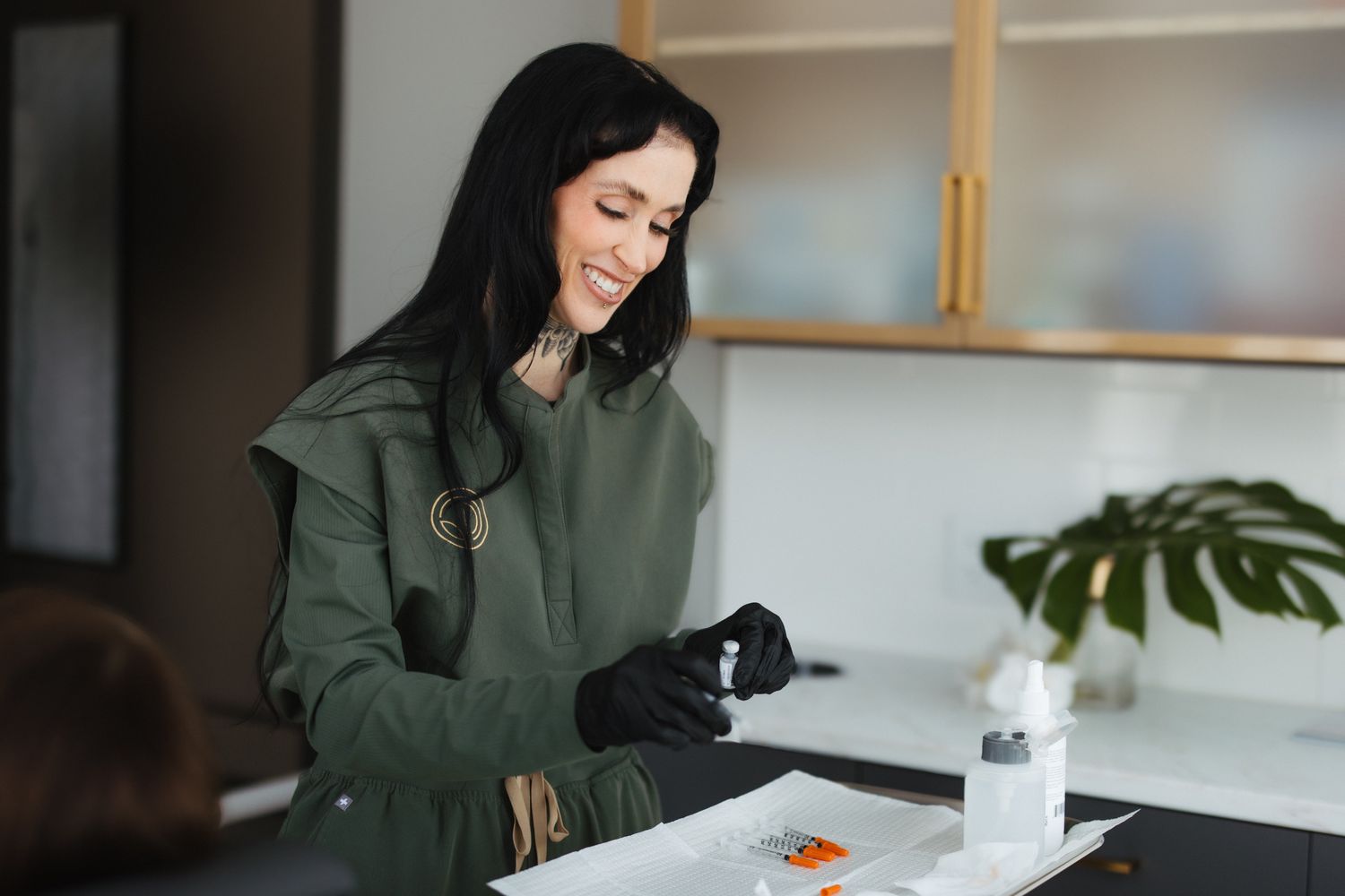 Woman with brown hair and wide-brimmed hat.