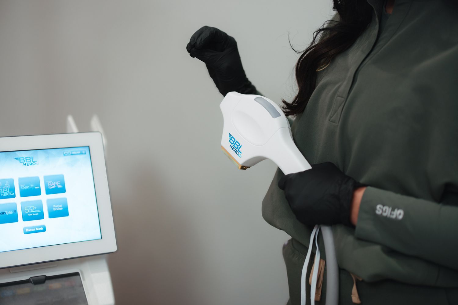 Woman showcasing elegance with jewelry and lighting.