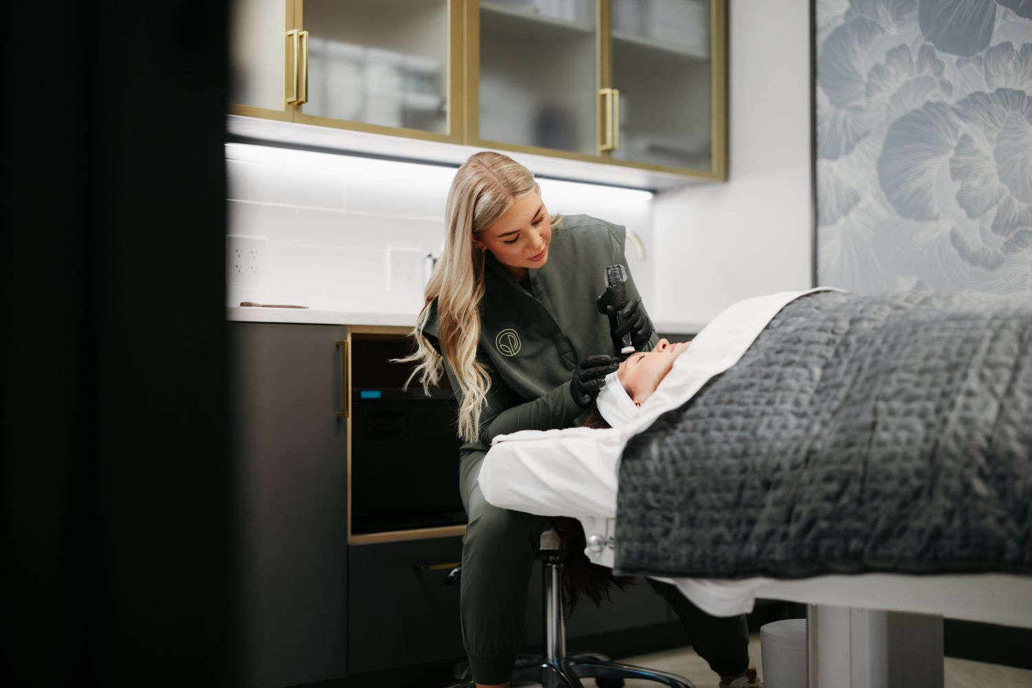 Smiling woman with natural hair and soft background.
