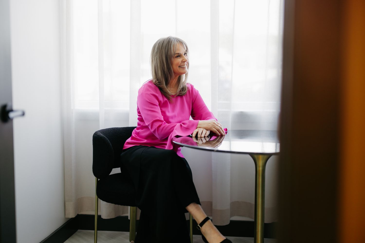 Woman practicing yoga in a serene environment.